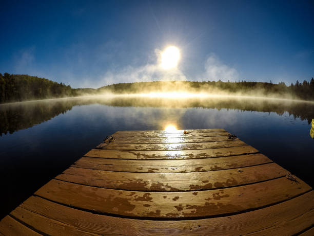 Foggy morning on a lake dock befor a fishing trip