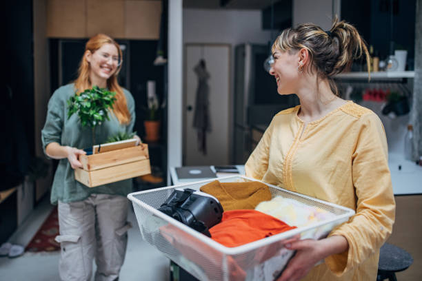 istock Women moving in new apartment 2148040749