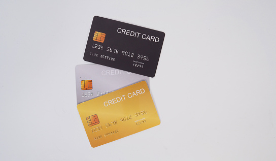 Three credit cards on white background.