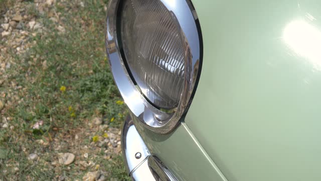 The headlight of a vintage car