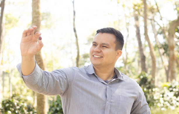 istock young latin man holding a colombian coffee bean 2148042018