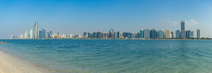 A panorama picture of the Abu Dhabi Beach Front as seen from across the water.