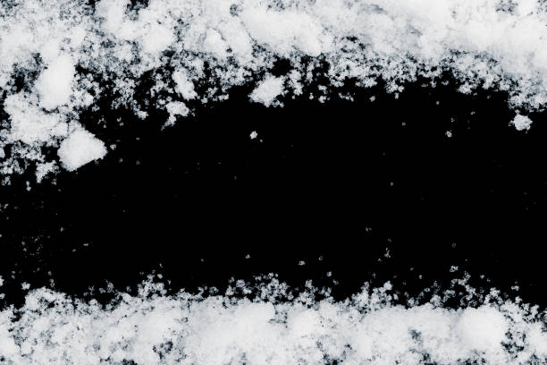 istock Snow border on a black background. Crunchy natural snow frame with space for copy. 2148042323
