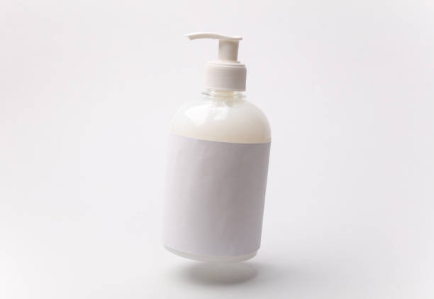 Floating bottle of liquid soap on a white background