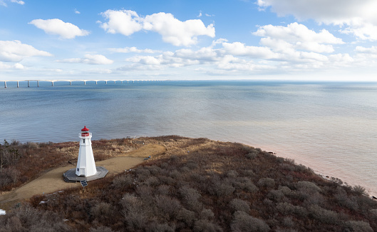 Aerial drone photograph of Cape Jourimain Lighthouse with Confederation Bridge in the background