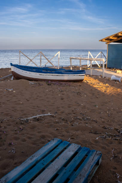istock Seaside and a white fence in the morning sunlight, Sicily 2148044330