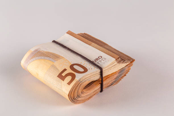 istock Bundle of 50 euro banknotes on a light background close-up. 2148044366