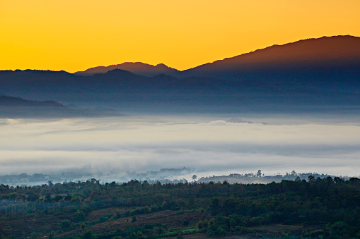 Sunrise and sea of clouds over Pai District, Mae Hong Son Province, Thailand. View from Yun Lai Viewpoint is Chinese Village