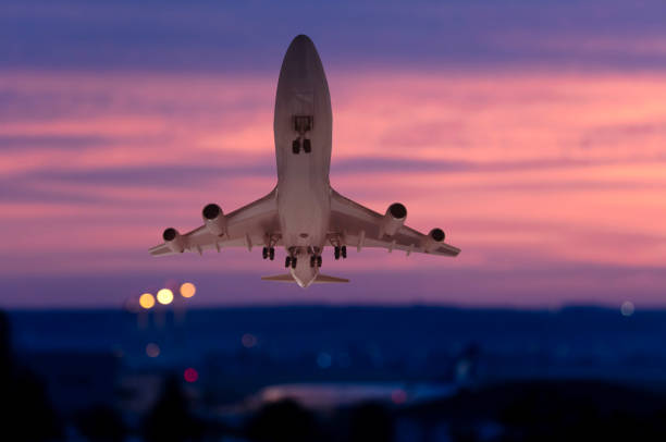 istock Passenger airplane is taking off at dusk 2148044919