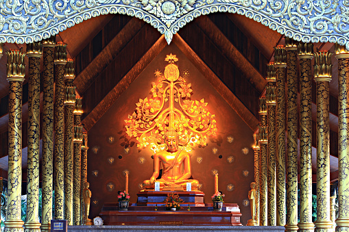 Golden buddha statue at Public Attraction Sirindhorn Wararam Phu Prao Temple (Wat Phu Prao) in Ubon Ratchathani province, Thailand