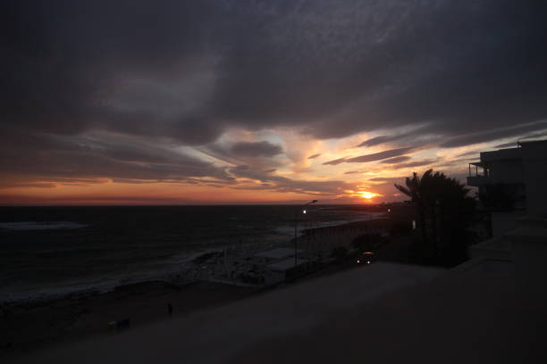 Horizontal photo of the sunset on the beach of Torre San Giovanni. Peaceful sea and horizon of the Mediterranean sea, southern Italy, Puglia