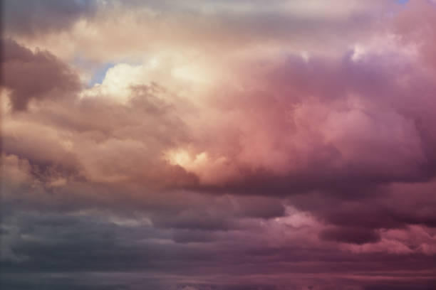 istock Lilac-pink clouds in the sky, evening sunlight on the clouds 2148048132