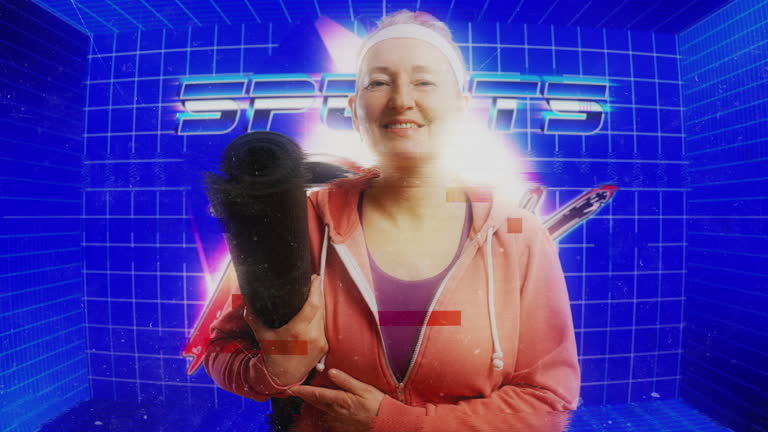 Happy woman in her 50s holding yoga mat against retro glitchy screen background