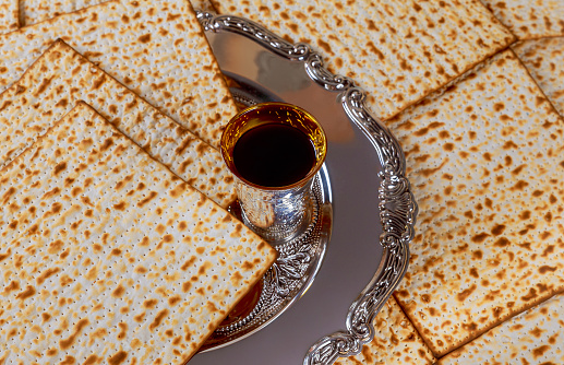 Jewish house meticulously prepare for Passover festivities with red kosher wine unleavened bread matzo