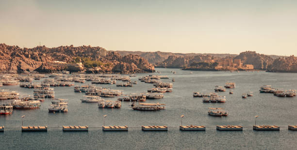 Aswan Governorate, Egypt January 2024:Tourists tour boat harbor on the Nile