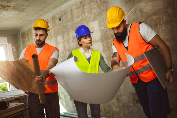 istock Construction team planning a building blueprint project on site with collaboration for architect innovation. Architecture, design and engineers with teamwork for successful 2148049420