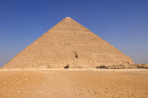 Kheops pyramid with no people under the blue sky of a sunny summer day, copy space
