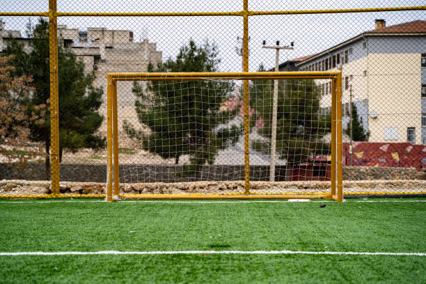 istock Goal post on artificial grass football pitch. 2148050388