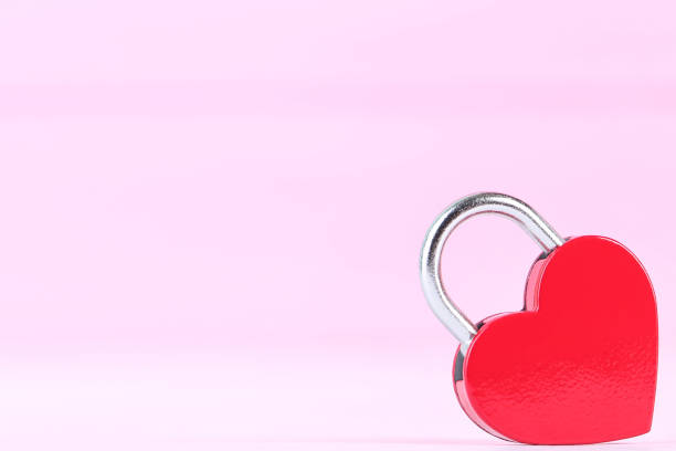 istock Valentine heart shaped padlock on pink background 2148050856