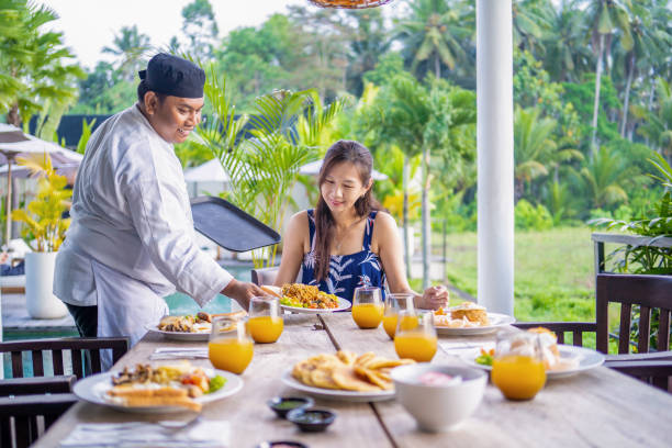 istock private chef sesrving guest at home 2148052100