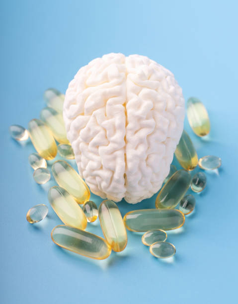 istock Concept model of the brain next to omega 3 capsules 2148052537