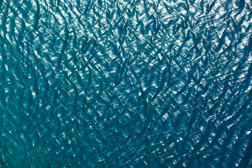 Top view of a sea surface. Deep blue. Background, texture, pattern