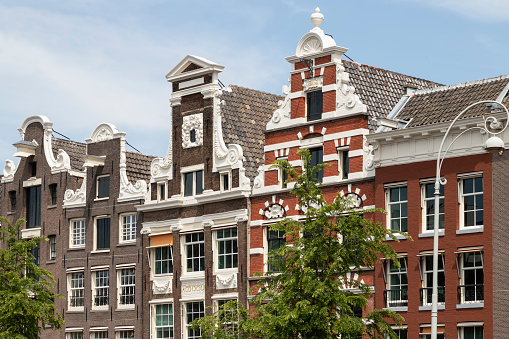 Historic facades of the canal houses along the Rokin in Amsterdam.