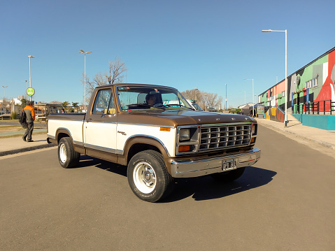 Avellaneda, Argentina - Aug 5, 2023; Old utility 1980s Ford Ranger F 100 XLT pickup truck in the street. Classic car show. Copy space. Sunny day
