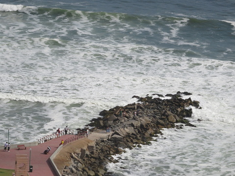 People walking on the beach, in the Miraflores district.