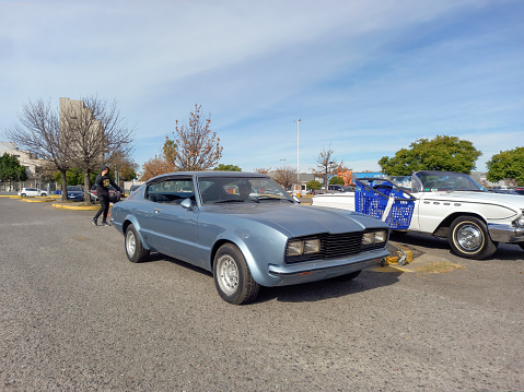 Buenos Aires, Argentina - Jun 4, 2023: Old blue shiny 1977 Ford Taunus JW Winograd special edition coupe at a classic car show in a parking lot. Sunny day. Copy space
