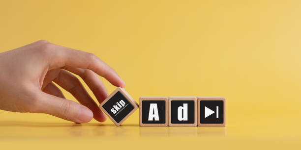 istock Clicking Button on Platform, Skip Ads Online Marketing Video Player Advertisement, Finger pointing the word skip ad on a wooden block 2148057207