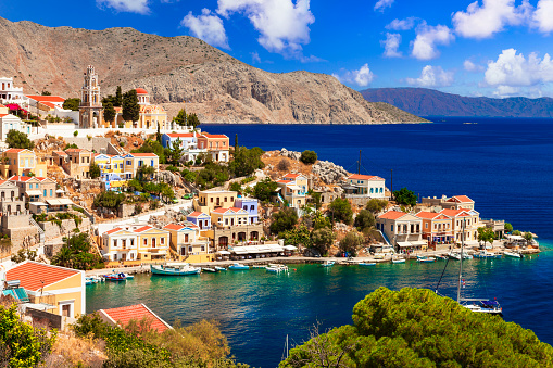 Authentic traditional greek island Symi with colorful houses and emerald sea. Dodecanese group of Greece