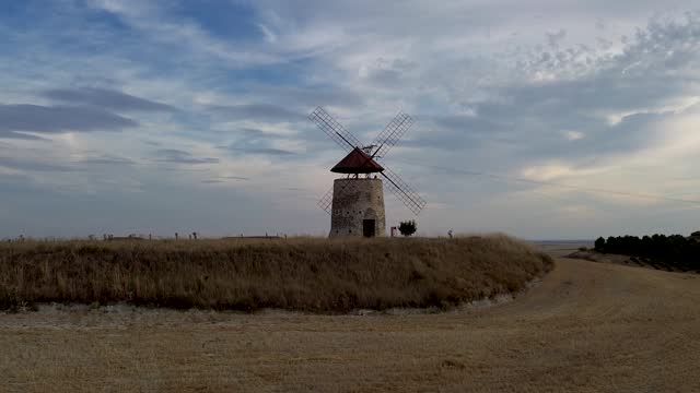 Castellan windmill in cultivated fields
