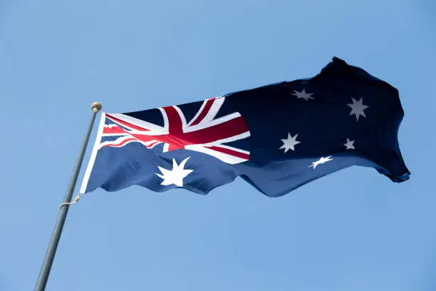 Photo of Australian flag against blue sky