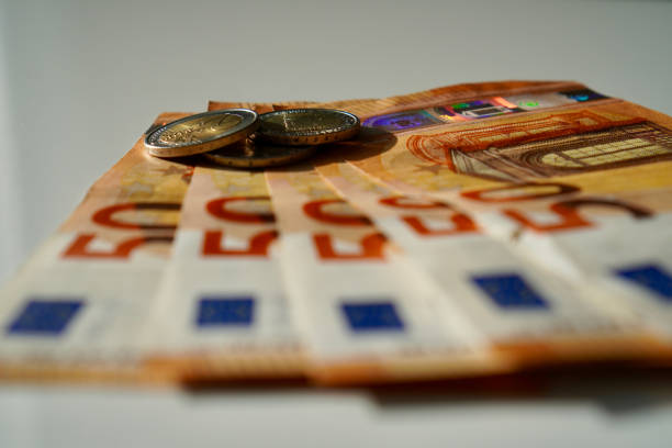 Euro coins and euro banknotes on the table