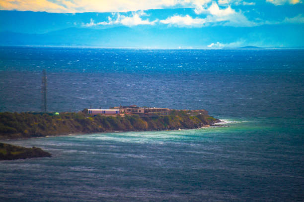 A serene view of a coastal peninsula, where land meets the sea, creating a picturesque scene of nature's beauty and the tranquil horizon over the water.