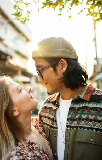 istock Affectionate young couple standing together outside in the summertime 2148062181