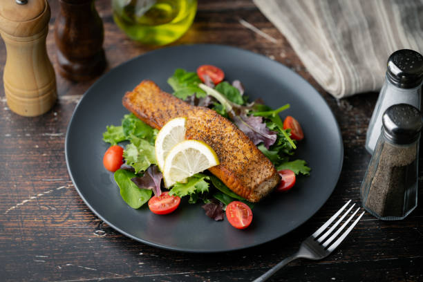 istock grilled salmon on salad with lemon 2148063991