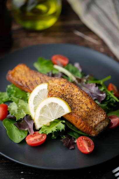istock grilled salmon on salad with lemon 2148064120