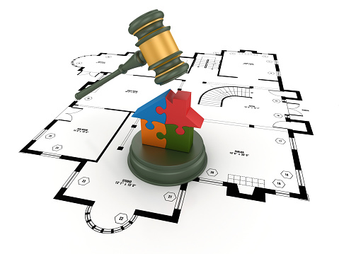 Legal Gavel on Floor Plan with Puzzle House  - White Background - 3D Rendering