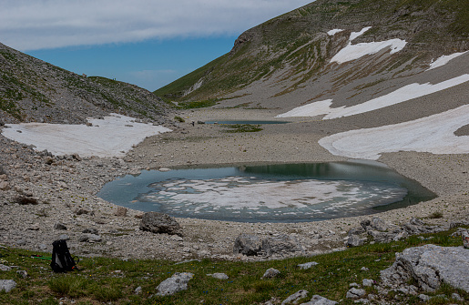 The upper part of the Vall-de-Madriu-Perafita-Claror is an exposed glacial landscape with snowfields and lakes.