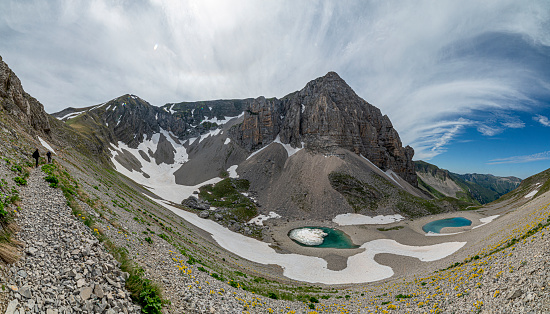 Tour du Montblanc beautiful mountain peaks and green valley. TMB trekking route scenic landscape in french Alps in Chamonix valley alpine scene