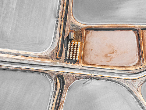 Aerial photo taken from a small plane showing a salt works and machinery at Useless Loop, Shark Bay, Western Australia