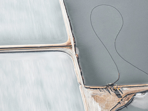 Aerial photo taken from a small plane showing a salt works and machinery at Useless Loop, Shark Bay, Western Australia