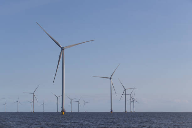 istock Windturbines in the water, producing alternative geen energy. 2148068962