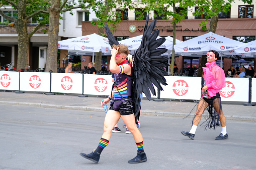 angel with wings queer person LGBTQ community in LGBT before pride parade, participants of international LGBTQ movement, cultural diversity, social activism, human rights, FRANKFURT - July 15, 2023