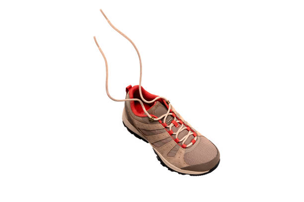 comfortable brown New trekking sneaker, waterproof hiking boot with laces isolated on white background, modern footwear, natural suede for outdoor hiking, camping