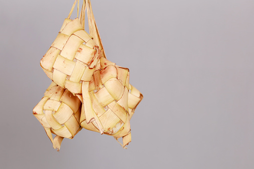 A diamond Ketupat shaped a natural rice casing made from young coconut leaves for cooking rice. Traditional food for Eid al-Fitr celebration