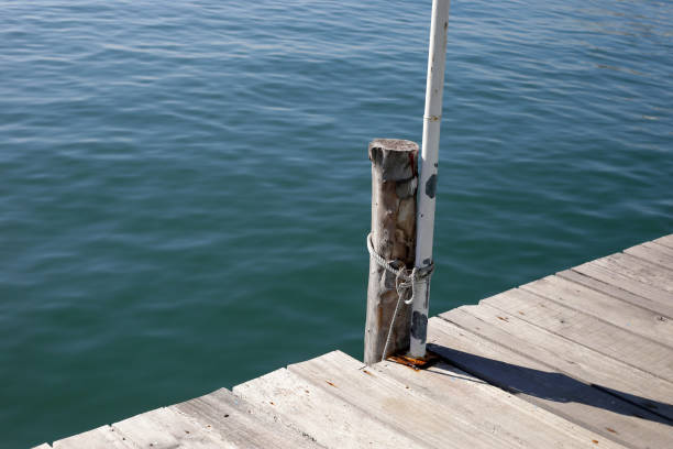 Part of a dock and pilings used for securing recreational boats near the shoreline of Chincoteague Island, Virignia.