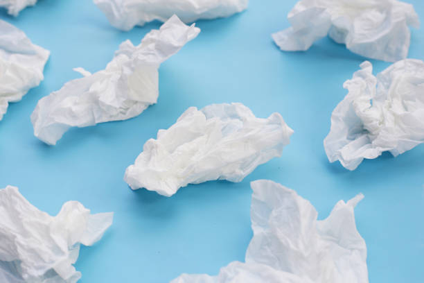 istock Crumpled tissue paper. Facial tissue on blue background. 2148072962